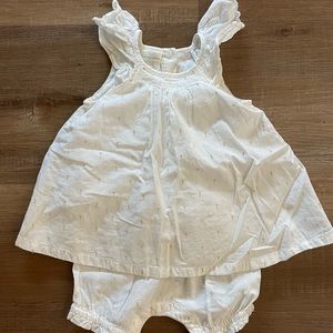 First Impressions white cotton dress with gold thread detail.